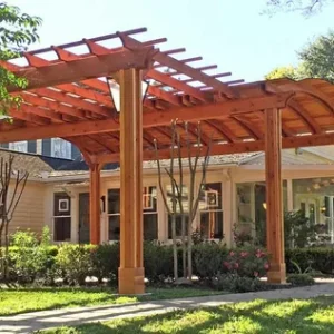 Modern pergola design in Dubai with stylish seating and outdoor lighting.